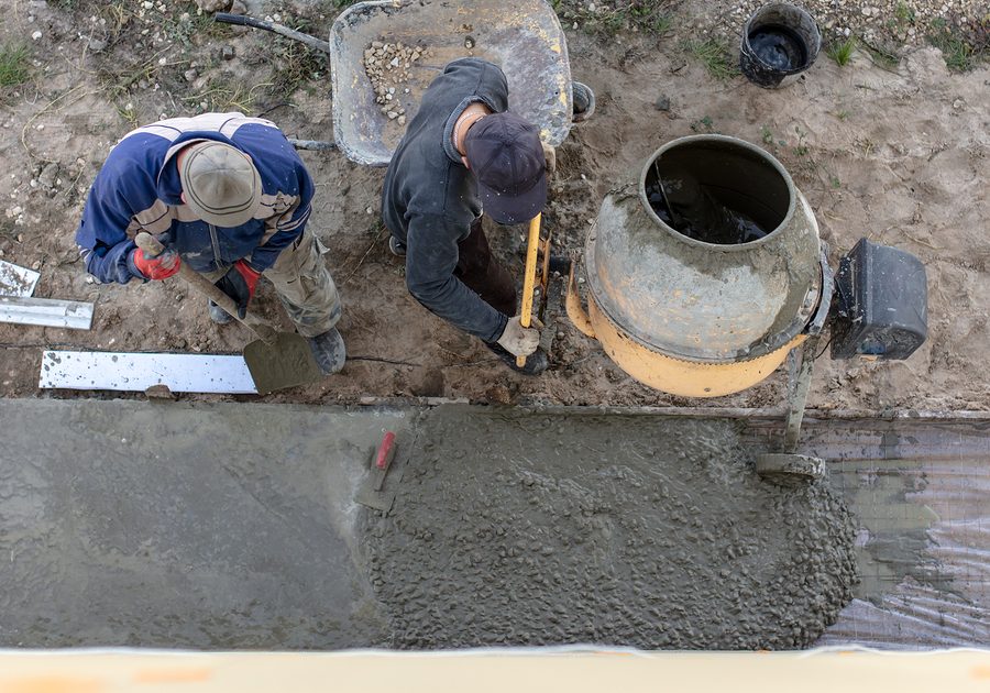 men pouring the cement